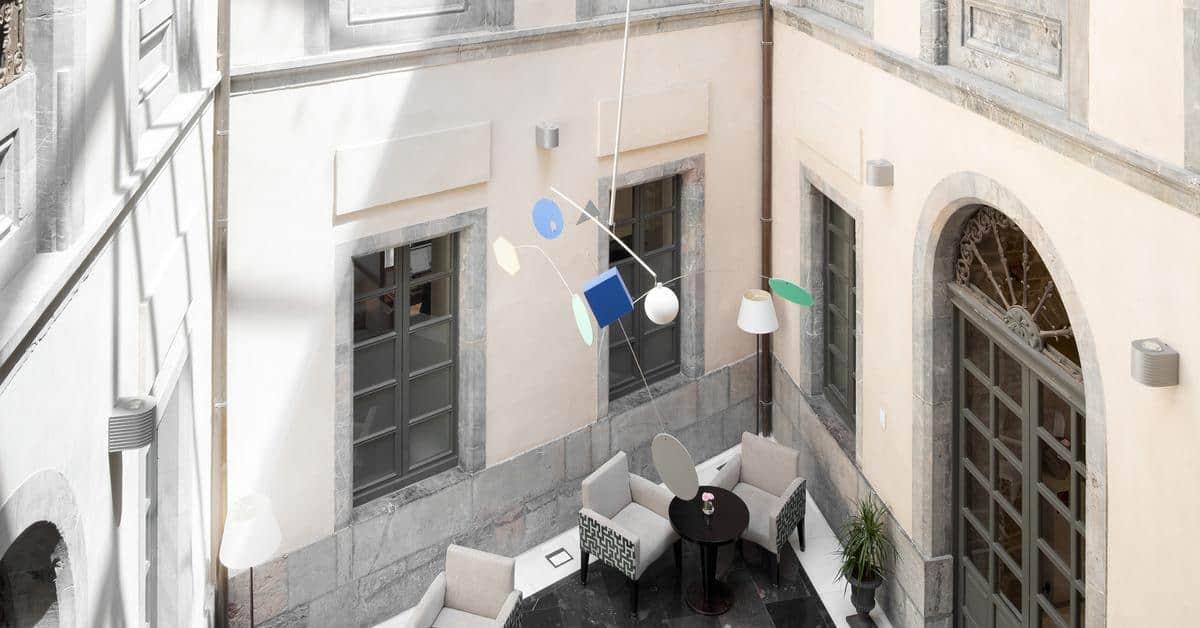 Palacio De Aviles Affiliated By Melia Exterior foto The mobile in the lobby of the National Gallery of Greece